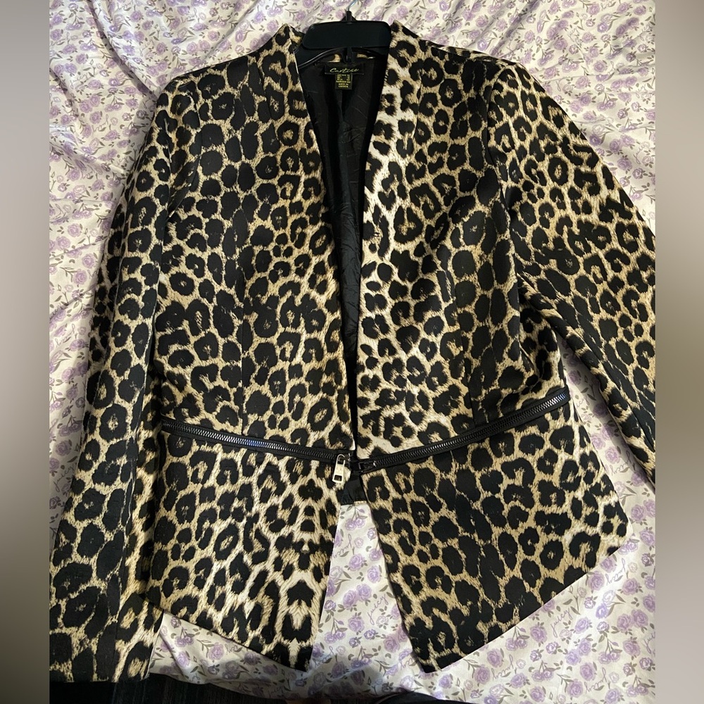 Cheetah carries blazer